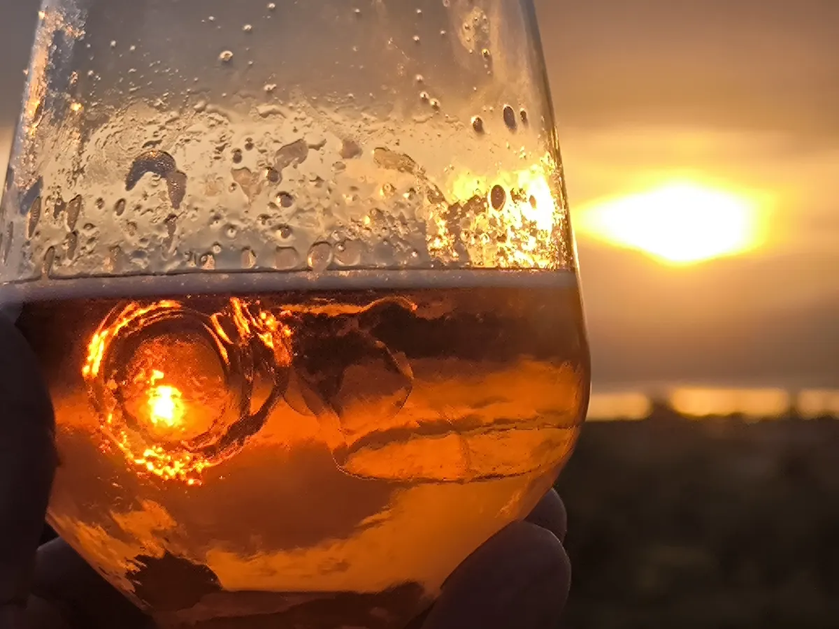 Glass of spritz at sunset on Lake Garda