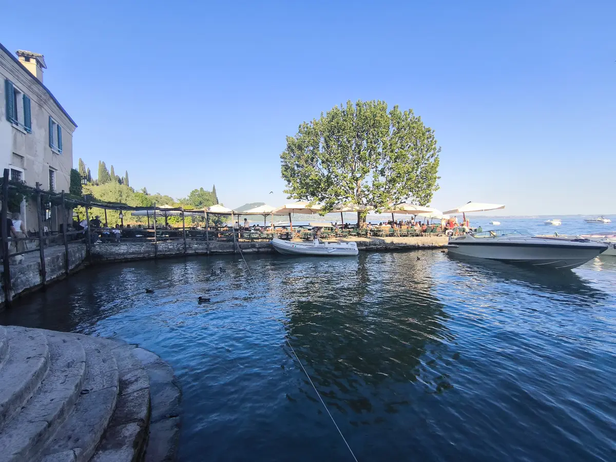 The small harbor and lakefront bar terrace at Punta San Vigilio