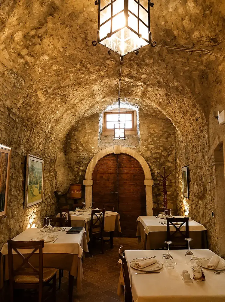 Stone dining room at Al Vecchio Forno in Pazzon near Caprino Veronese