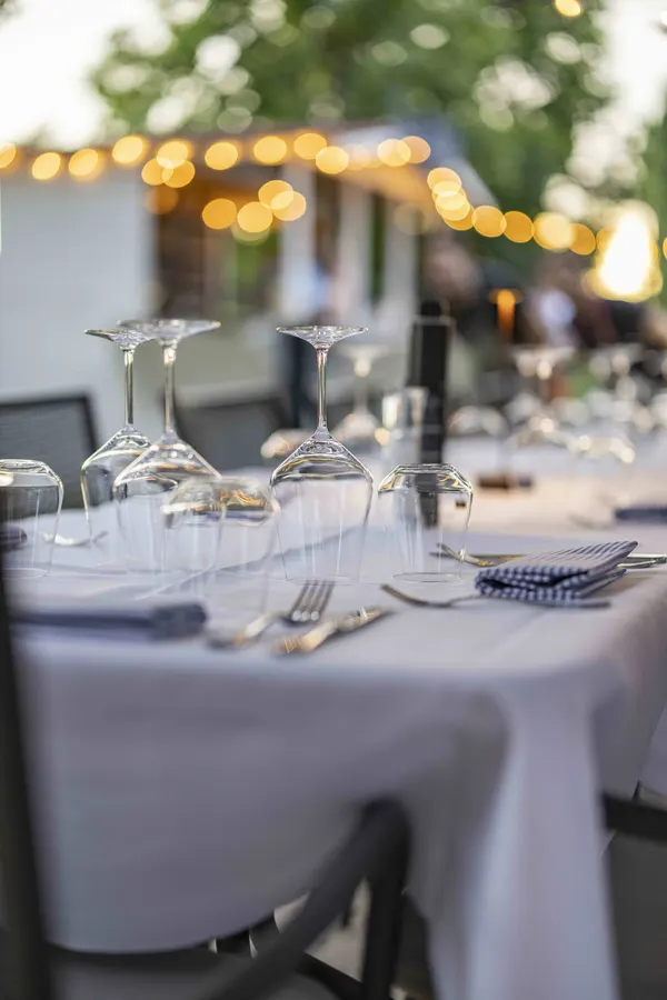 Outdoor summer table setting at Osteria Tenuta Preella in Cavaion Veronese