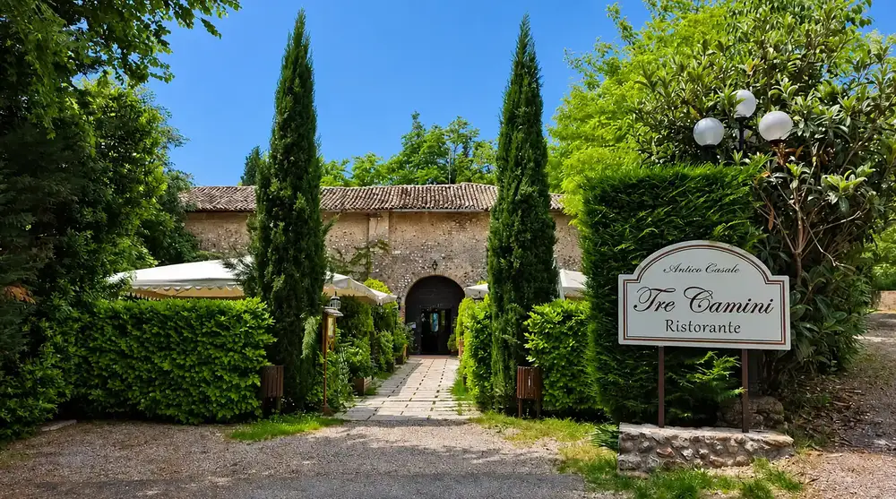Exterior entrance and sign at Antico Casale Tre Camini restaurant in Costermano sul Garda