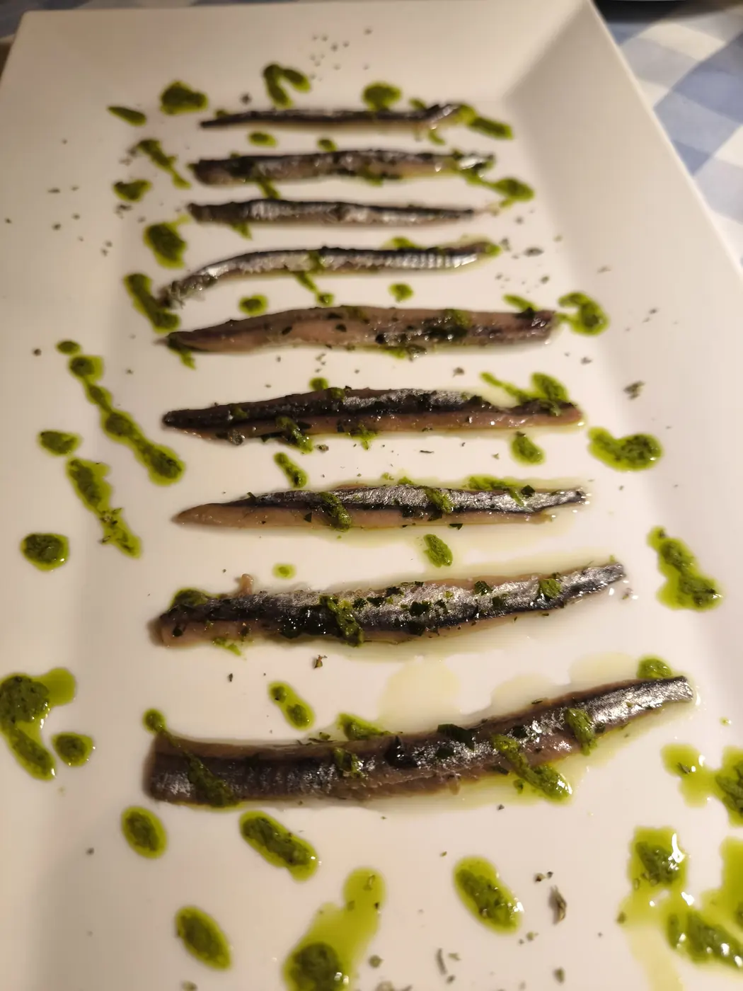 Anchovies with green herb sauce at Osteria La Lanterna in Tacconi