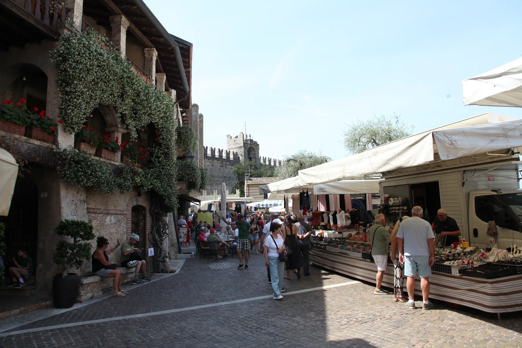 Weekly market stalls beside the marina in Torri del Benaco