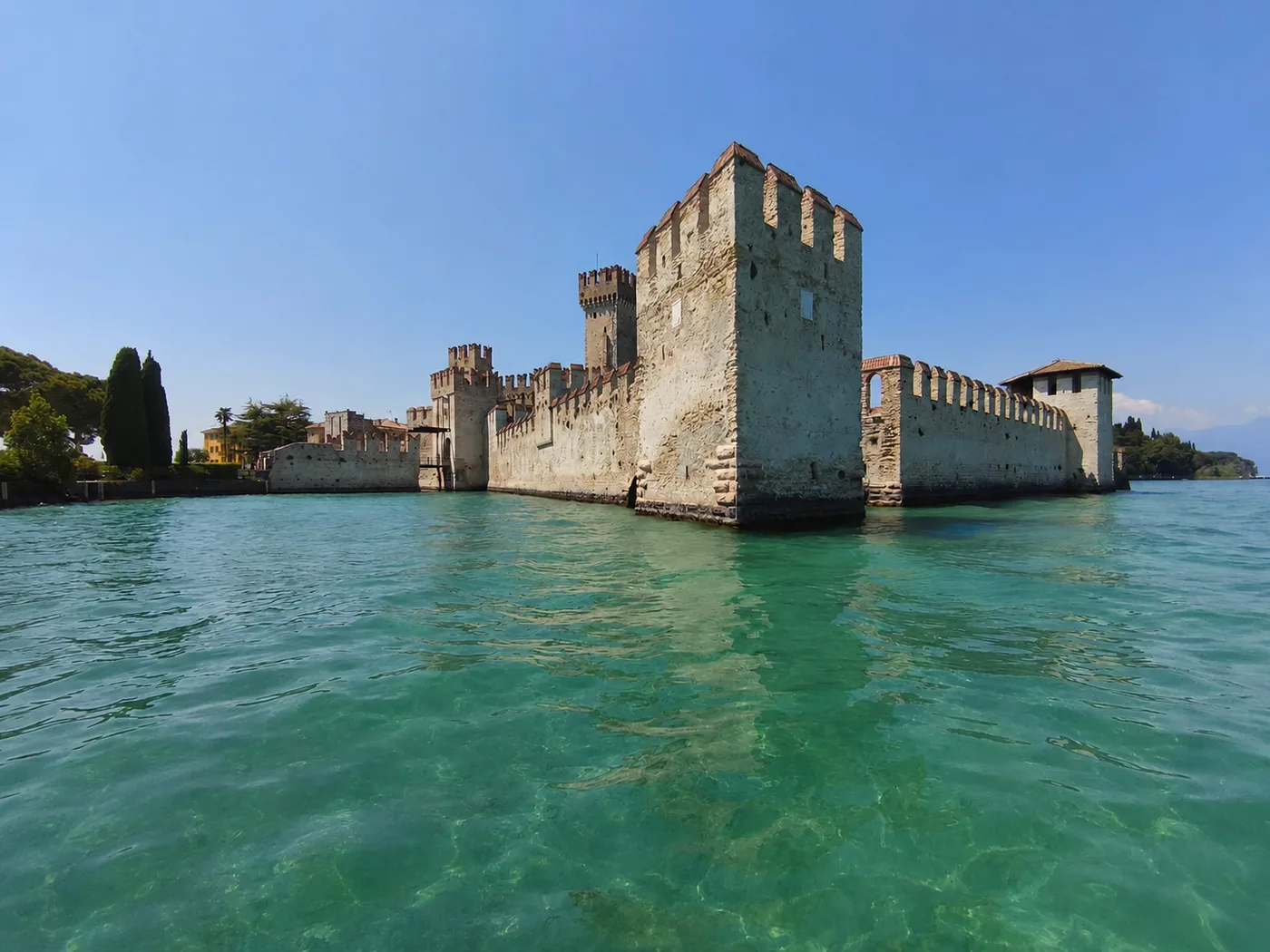 Scaligero Castle in Sirmione seen from a boat on Lake Garda