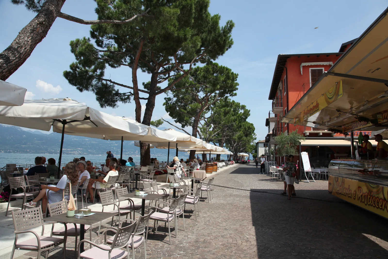 Lakefront walkway and tables in Torri del Benaco